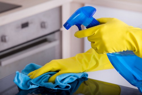 Specialist upholstery cleaning equipment in use on a sofa