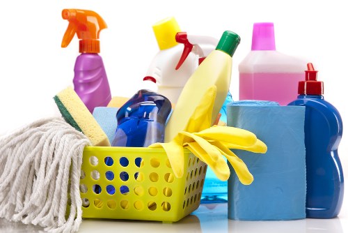 Technician removing pet odours from sofa fabric with deep cleaning tools